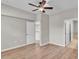 Bright main bedroom featuring hardwood floors and neutral color palette with ensuite bathroom at 6528 Sedgeford Dr, Lakeland, FL 33811