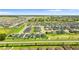 Expansive aerial view of a new residential community showcasing well-manicured lawns and serene surroundings at 716 Vittorio Dr, Winter Haven, FL 33884