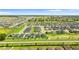 Expansive aerial view of a new residential community showcasing well-manicured lawns and serene surroundings at 716 Vittorio Dr, Winter Haven, FL 33884