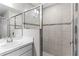 Stylish bathroom featuring tiled walk-in shower and modern fixtures at 716 Vittorio Dr, Winter Haven, FL 33884