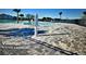 Resort-style pool featuring a zero entry, in-water seating, and stunning lake views within the Villamar community at 716 Vittorio Dr, Winter Haven, FL 33884