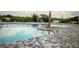 Community pool with tiled pool deck and access for easy entry in a well maintained pool area at 716 Vittorio Dr, Winter Haven, FL 33884
