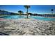 Resort-style pool featuring a zero entry, in-water seating, and stunning lake views within the Villamar community at 716 Vittorio Dr, Winter Haven, FL 33884