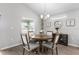 Cozy dining area with modern chandelier, stylish furnishings and neutral tones at 716 Vittorio Dr, Winter Haven, FL 33884