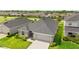 Charming home with well-manicured lawn and attached two-car garage at 716 Vittorio Dr, Winter Haven, FL 33884