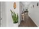 Hallway showcasing wood-look floors, neutral paint, and easy access to various rooms within the home at 716 Vittorio Dr, Winter Haven, FL 33884