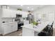 Modern kitchen with white cabinets, stainless steel appliances, and a large center island with seating at 716 Vittorio Dr, Winter Haven, FL 33884