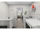 Well-lit laundry room with modern appliances and ample counter space at 716 Vittorio Dr, Winter Haven, FL 33884