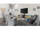 Comfortable living room with stylish seating, a large television, and a welcoming atmosphere at 716 Vittorio Dr, Winter Haven, FL 33884