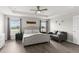 Serene main bedroom with natural light, neutral palette and hardwood flooring at 716 Vittorio Dr, Winter Haven, FL 33884