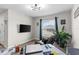 Office with wood-look flooring, cozy recliner, and ample space for work or relaxation at 716 Vittorio Dr, Winter Haven, FL 33884