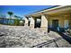 Outdoor covered area with stone columns, ceiling fans, and tables for residents to relax or entertain guests at 716 Vittorio Dr, Winter Haven, FL 33884