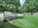 Lush backyard with a canopy structure, providing ample space and privacy at 7714 Chase Rd, Lakeland, FL 33810