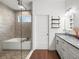 Beautiful bathroom featuring dual sinks, granite counters, and a tub/shower combo at 7714 Chase Rd, Lakeland, FL 33810