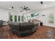 Inviting living room with an open layout, hardwood floors, and a comfortable leather sofa at 7714 Chase Rd, Lakeland, FL 33810