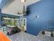 Outdoor kitchen with a sink, a grill, and a view of the enclosed patio at 7714 Chase Rd, Lakeland, FL 33810