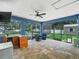 Enclosed patio with pavers, an outdoor bar, seating, and a view of the pool at 7714 Chase Rd, Lakeland, FL 33810
