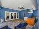 Enclosed patio with pavers, an outdoor kitchen, and seating at 7714 Chase Rd, Lakeland, FL 33810