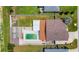 Aerial view of backyard featuring a pool, patio, pergola, and a well-maintained lawn at 7929 Ashley Pointe Dr, Lakeland, FL 33810