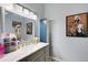 Modern bathroom with stylish vanity, marble countertop, and sleek lighting fixtures, offering a spa-like experience at 7929 Ashley Pointe Dr, Lakeland, FL 33810