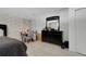 Comfortable bedroom featuring a black bed frame, dresser, and soft lighting at 7929 Ashley Pointe Dr, Lakeland, FL 33810