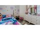 Cheerful bedroom with playful decor, perfect for , featuring custom-painted walls and ample natural light at 7929 Ashley Pointe Dr, Lakeland, FL 33810