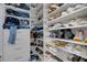 Well-organized walk-in closet with custom shelving and ample storage space for clothes, shoes, and accessories at 7929 Ashley Pointe Dr, Lakeland, FL 33810