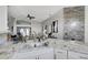 Bright kitchen with granite countertops, stainless steel appliances, and open layout to living space at 7929 Ashley Pointe Dr, Lakeland, FL 33810