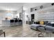 Open concept living space with kitchen, dining, and living areas with wood-look tile flooring at 7929 Ashley Pointe Dr, Lakeland, FL 33810