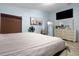 Bright main bedroom features a serene ambiance and a large dresser, creating a relaxing retreat at 7929 Ashley Pointe Dr, Lakeland, FL 33810