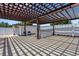 An outdoor kitchen featuring a grill under a pergola at 7929 Ashley Pointe Dr, Lakeland, FL 33810