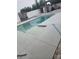 Backyard swimming pool with a spacious sundeck, pergola, privacy fence, and lush landscaping at 7929 Ashley Pointe Dr, Lakeland, FL 33810