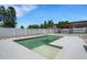 Backyard featuring a pool, pergola, and manicured landscaping at 7929 Ashley Pointe Dr, Lakeland, FL 33810