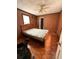 Bedroom with hardwood floors, window, and bed frame at 803 26Th Nw St, Winter Haven, FL 33881