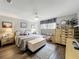 Serene bedroom with ceiling fan, decorative furniture and neutral color palette at 8640 Firestone Cir, Clermont, FL 34711