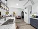 Well-lit kitchen showcasing granite countertops, modern fixtures, and sleek cabinetry at 8640 Firestone Cir, Clermont, FL 34711
