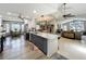 Spacious kitchen with a large island, stone countertops, stainless appliances, and open floor plan at 8640 Firestone Cir, Clermont, FL 34711