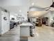 Open concept kitchen island with bar seating in a bright, spacious home interior at 8640 Firestone Cir, Clermont, FL 34711