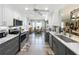 Modern kitchen with stone countertops, stainless appliances, and a cozy breakfast nook at 8640 Firestone Cir, Clermont, FL 34711