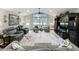 Bright living room with large windows, comfortable seating, and a media center at 8640 Firestone Cir, Clermont, FL 34711