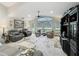 Bright living room with large windows, comfortable seating, and a media center at 8640 Firestone Cir, Clermont, FL 34711