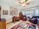 Comfortable office space with a wooden desk, leather chair and view to the outside at 8640 Firestone Cir, Clermont, FL 34711