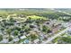 Overhead shot of neighborhood featuring tree-lined streets, varied home styles, and community amenities at 1019 Milner E Dr, Lakeland, FL 33810