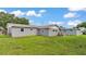 Expansive backyard featuring a well-maintained lawn and partial fencing at 1019 Milner E Dr, Lakeland, FL 33810