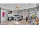 Comfortable bedroom featuring a ceiling fan, closet space, and a serene atmosphere for relaxation at 1019 Milner E Dr, Lakeland, FL 33810