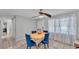 Cozy dining room featuring a floral tablecloth, comfortable seating, and a welcoming atmosphere at 1019 Milner E Dr, Lakeland, FL 33810