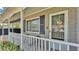 Inviting front porch with seating, brick accents, and a welcoming door with a wreath at 1019 Milner E Dr, Lakeland, FL 33810