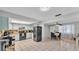 Spacious kitchen with light blue cabinets, black appliances, and adjacent dining space for easy entertaining at 1019 Milner E Dr, Lakeland, FL 33810