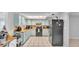 Functional kitchen features light blue cabinetry, black appliances, and practical layout for cooking at 1019 Milner E Dr, Lakeland, FL 33810