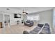 Bright living room with tile floors, a ceiling fan, and a flat screen TV at 1019 Milner E Dr, Lakeland, FL 33810